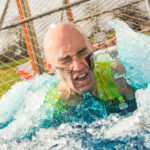 Man busting out of icy water