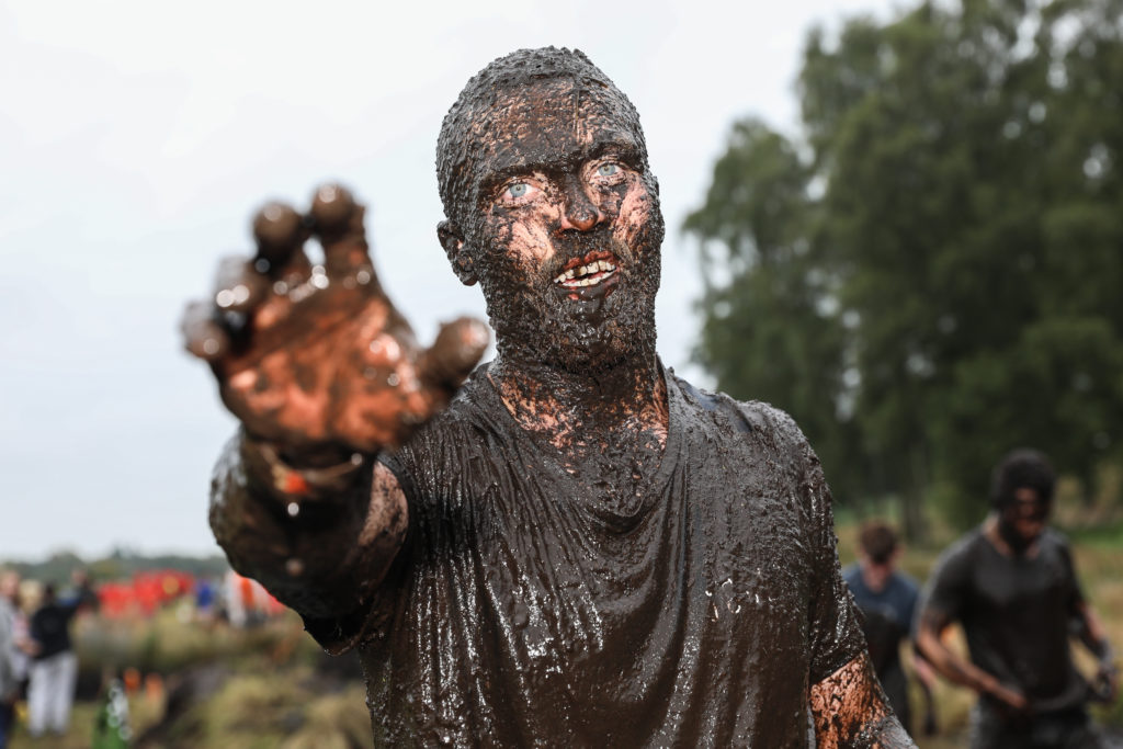 man covered mud