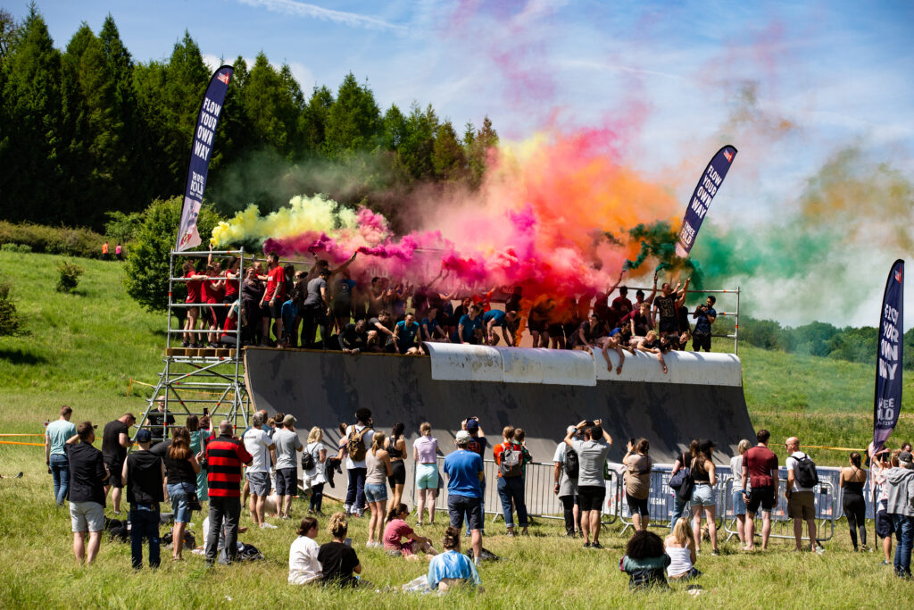 colourful flares on tough mudder obstacle